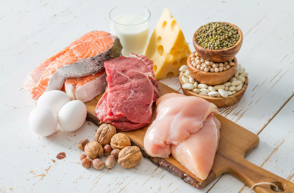 A variety of protein sources including skinless chicken, fish, eggs, and milk.