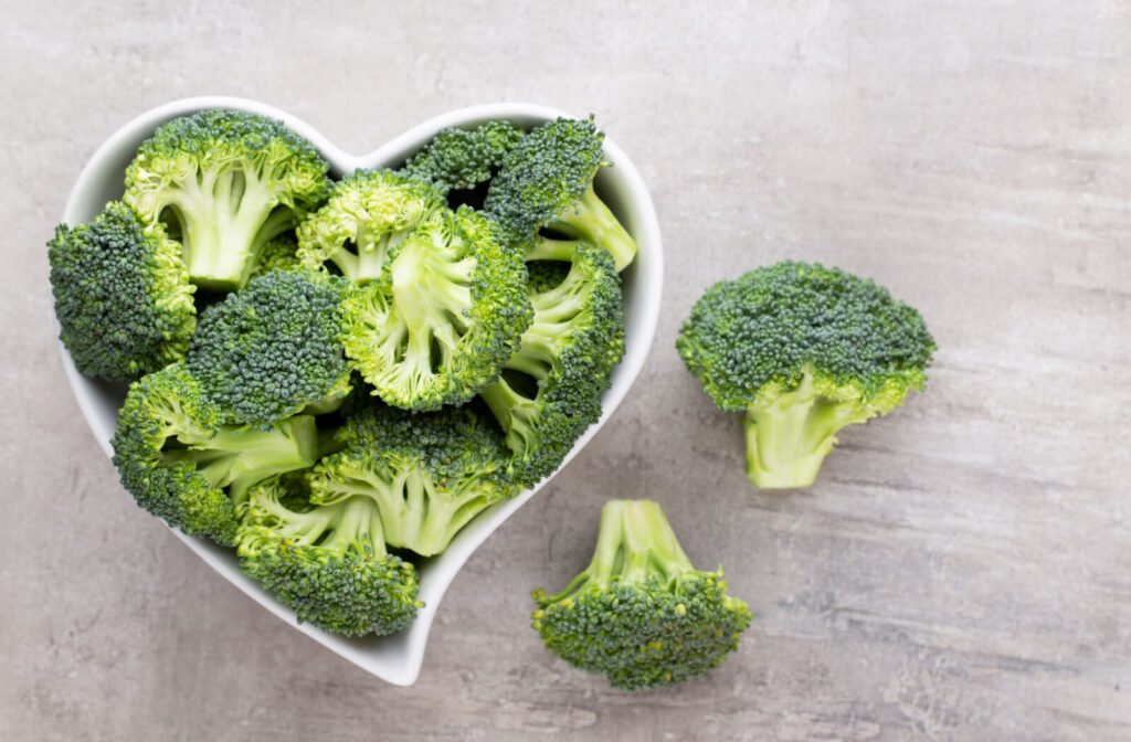 Fresh broccoli in a heart-shaped bowl.