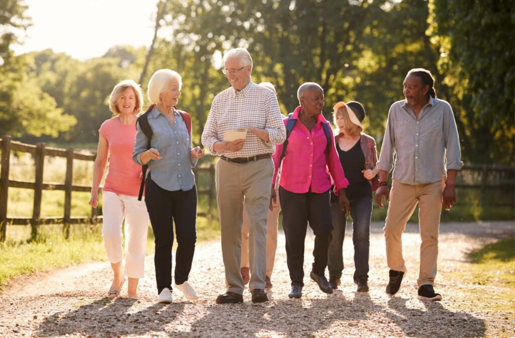 A happy group of older adults walking outdoors.